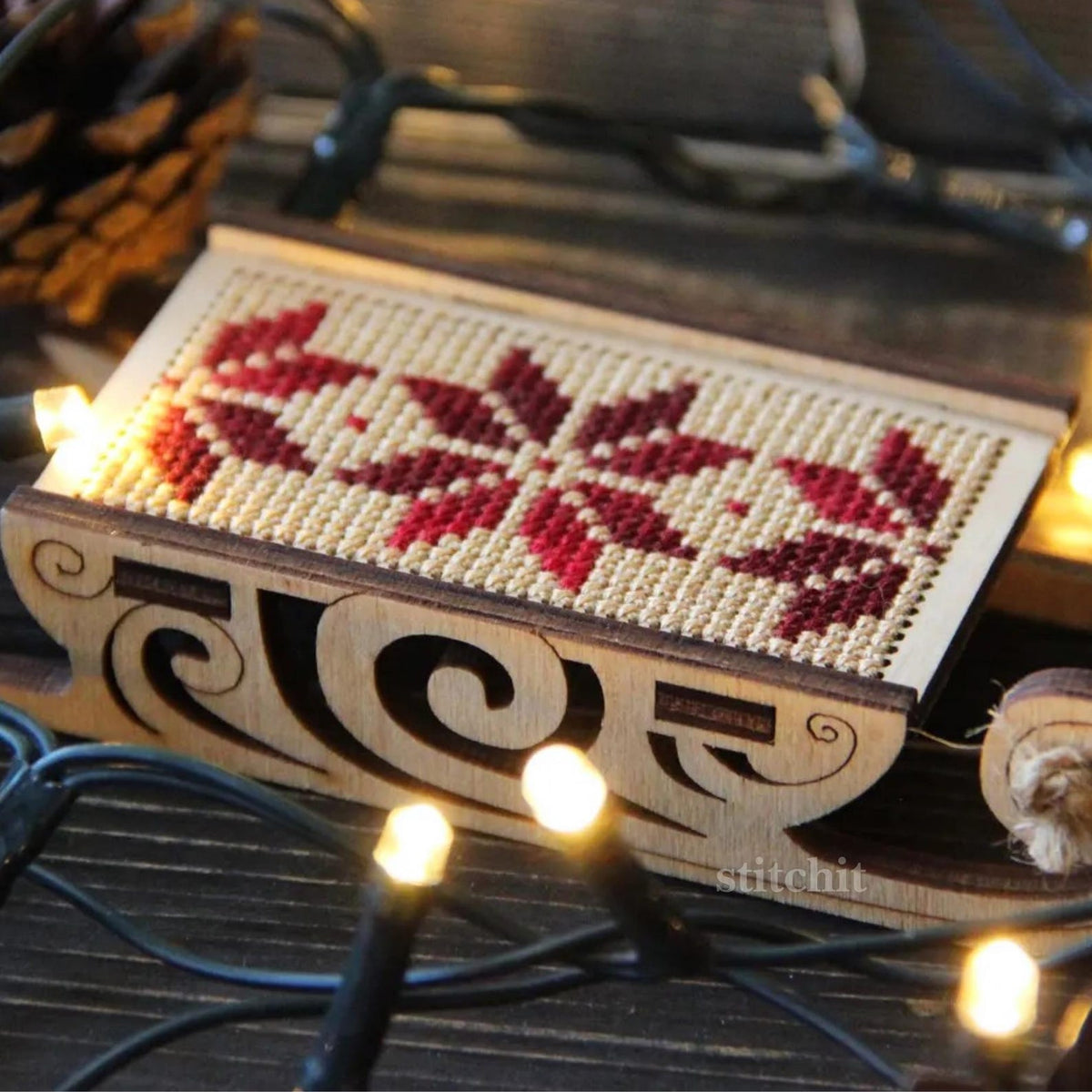 Beginner Embroidery Kit | Scandinavian Christmas Sleigh | Product Closeup And Christmas Lights
