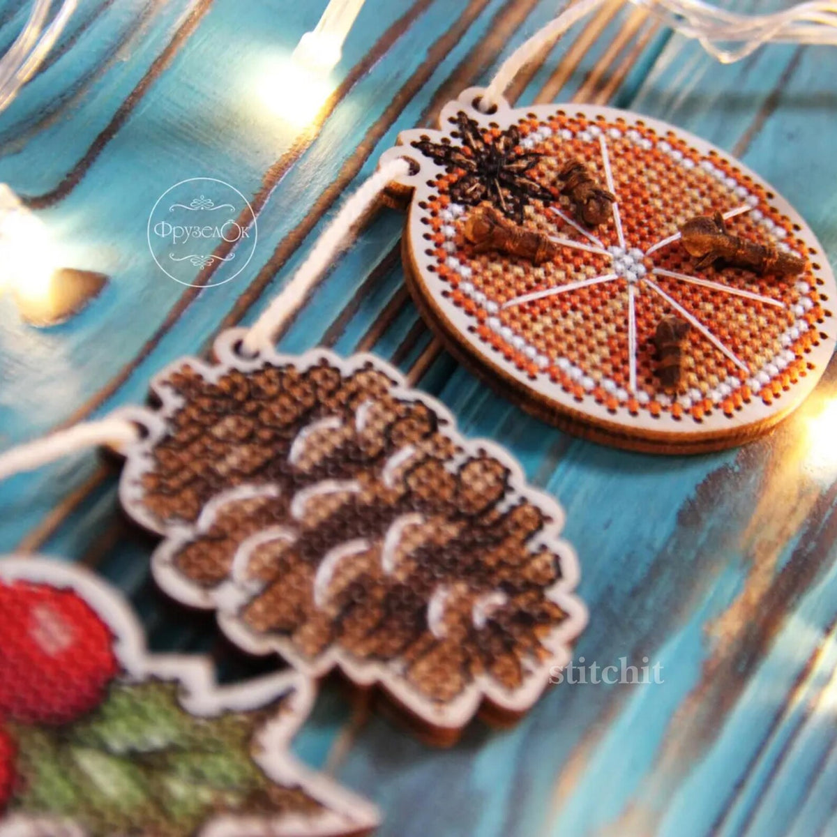 Holiday Embroidery Kit On Wood | Christmas Garland | Product CLoseup And Christmas Lights