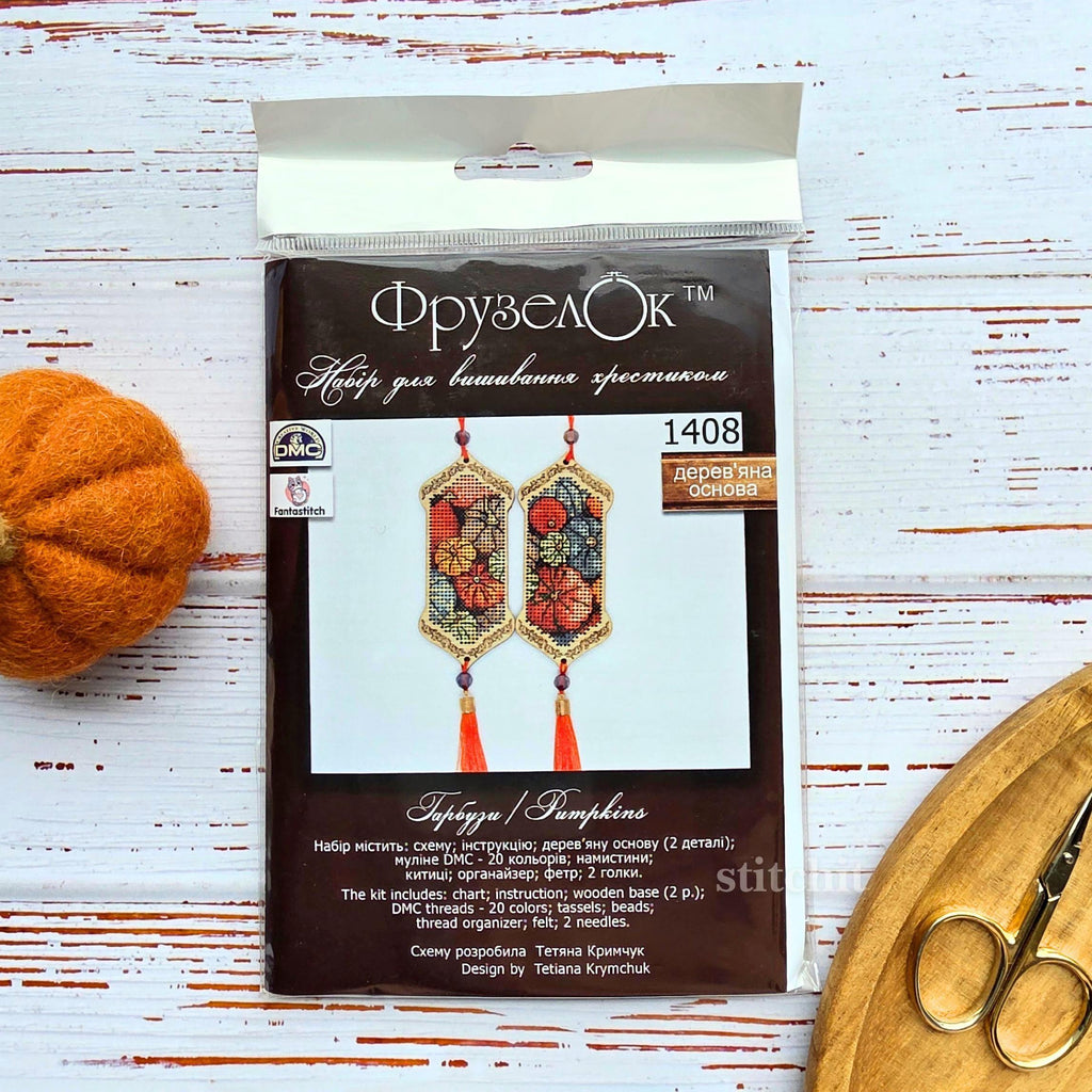 Pumpkin Cross Stitch Kit on Wood packaging with floral design and tassels for autumn decor.