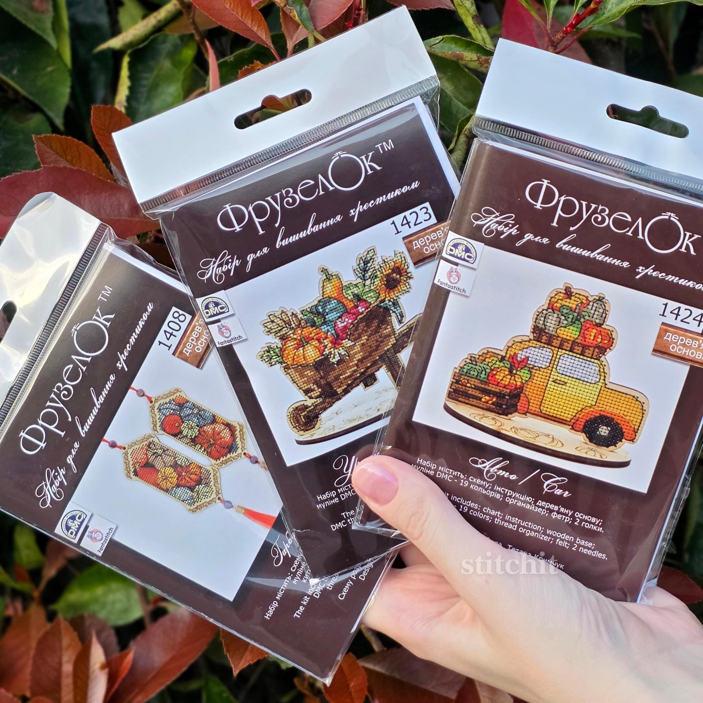 Harvest Cross Stitch Kit on Wood packages showcasing autumn-themed designs and vibrant colors.