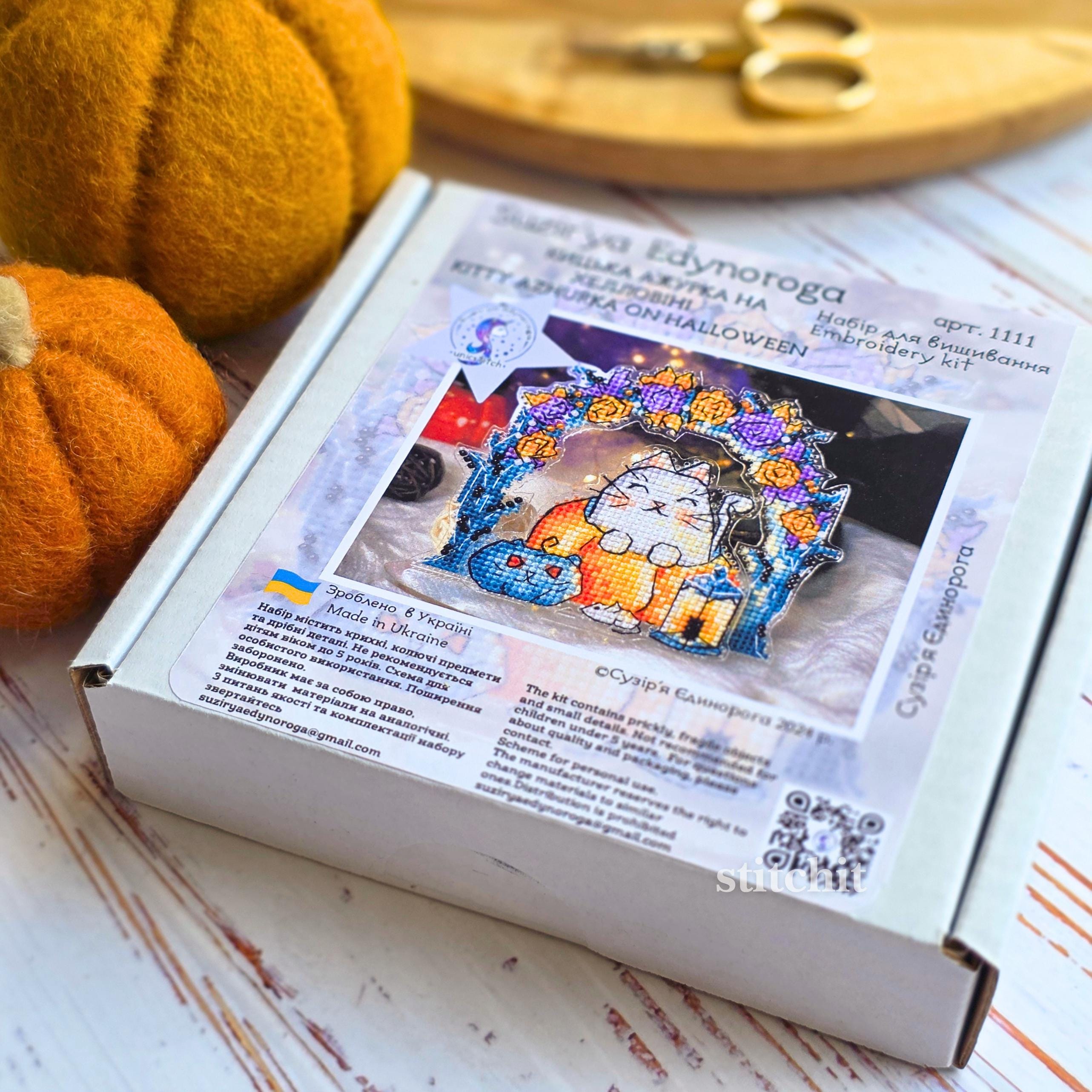 Cat Pumpkin Cross Stitch Kit — cat sitting on pumpkin under arch with lanterns, beaded embroidery on flexible plastic